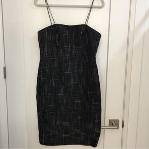 Black silk dress. With beading embellishment. Size 8.